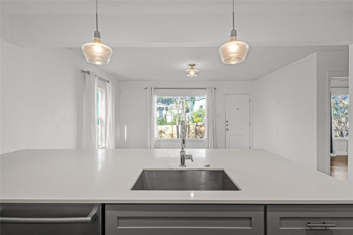 713 East 45th Street Austin, TX 78751 - Photo 13 of 28 a kitchen with a window and a chandelier