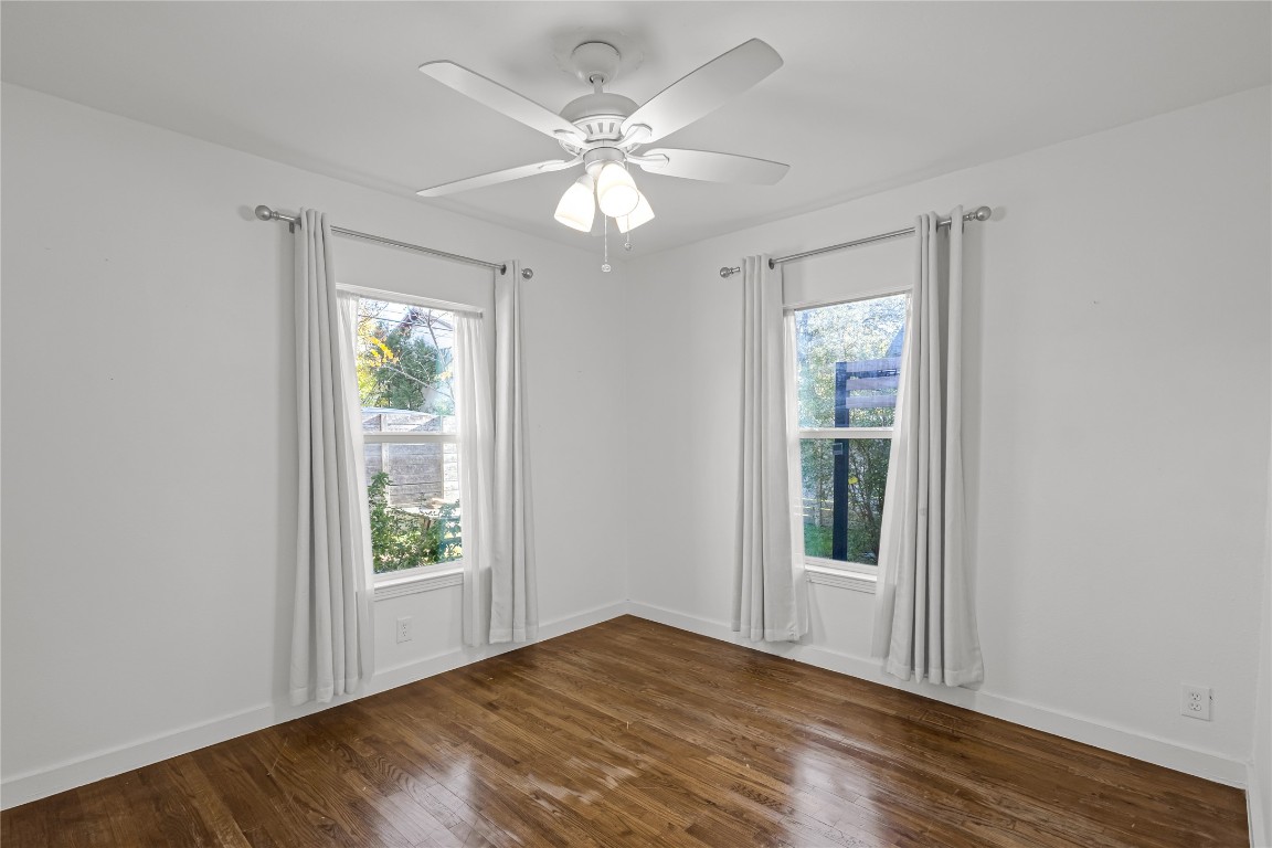 713 East 45th Street Austin, TX 78751 - Photo 17 of 28 a view of an empty room with wooden floor and a window