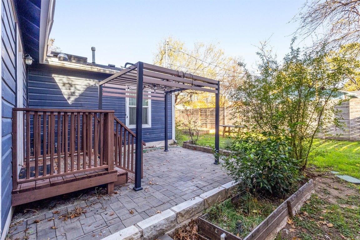 713 East 45th Street Austin, TX 78751 - Photo 25 of 28 a view of a house with a small yard and wooden fence