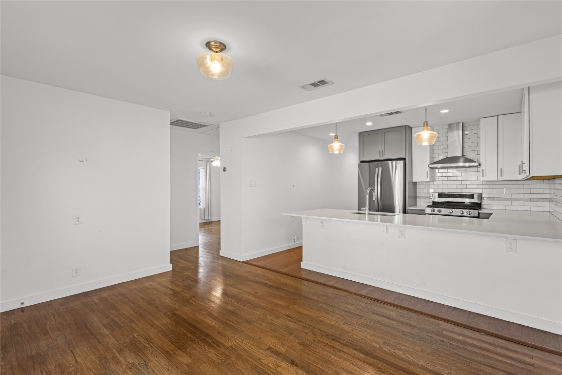 713 East 45th Street Austin, TX 78751 - Photo 6 of 28 a view of kitchen with stainless steel appliances refrigerator and stove