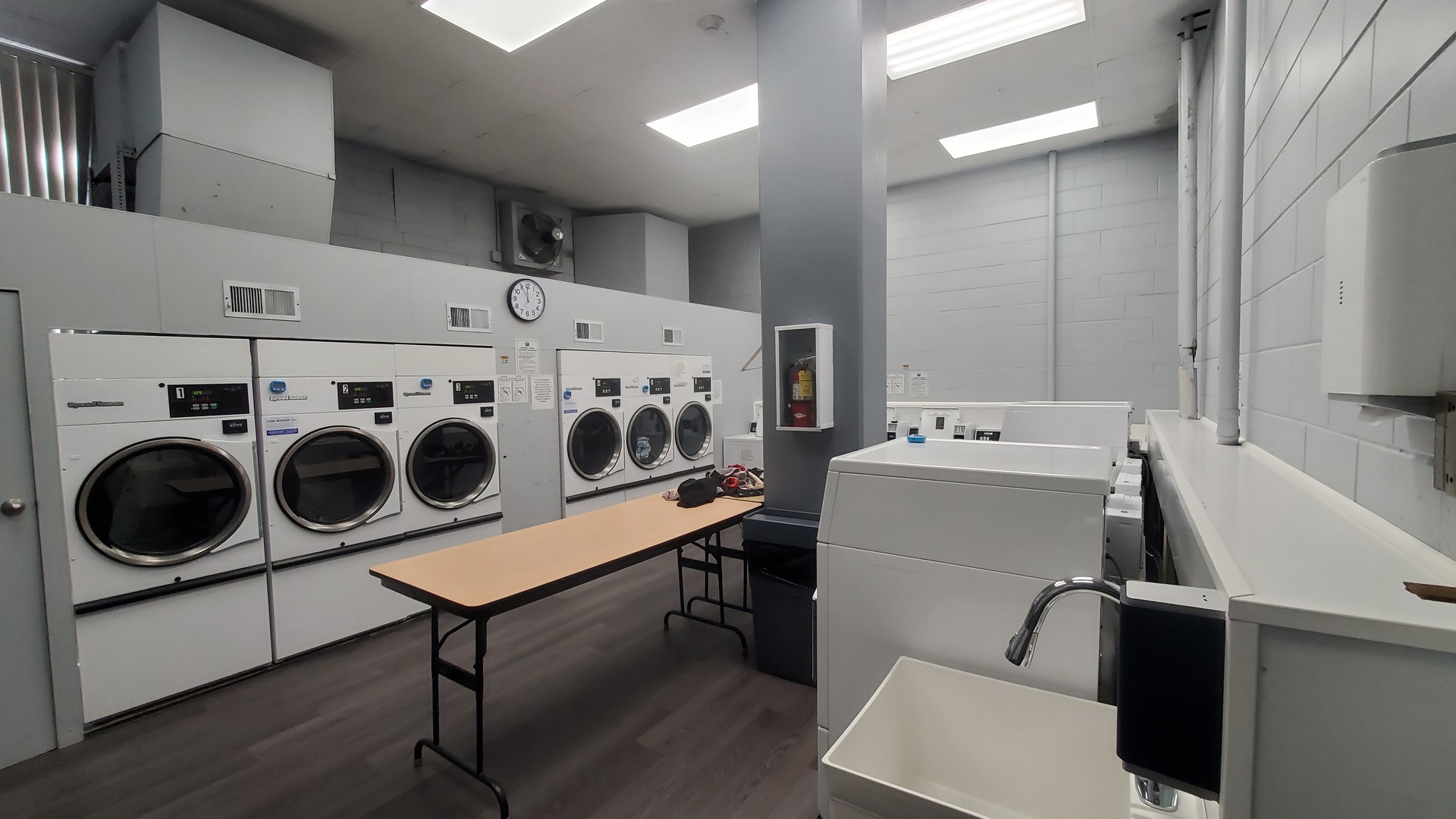 20 North Tower Road, Unit 6J Oak Brook, IL 60523 - Photo 17 of 23 a utility room with dryer washer and a refrigerator