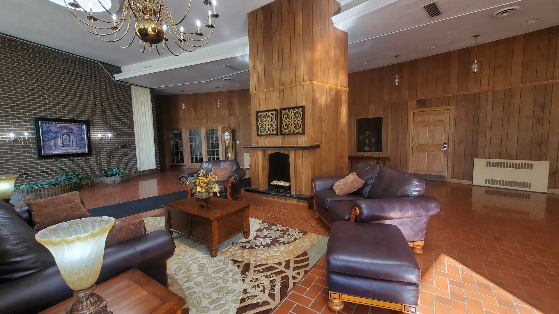 20 North Tower Road, Unit 6J Oak Brook, IL 60523 - Photo 6 of 23 a living room with furniture a dining table and a fireplace