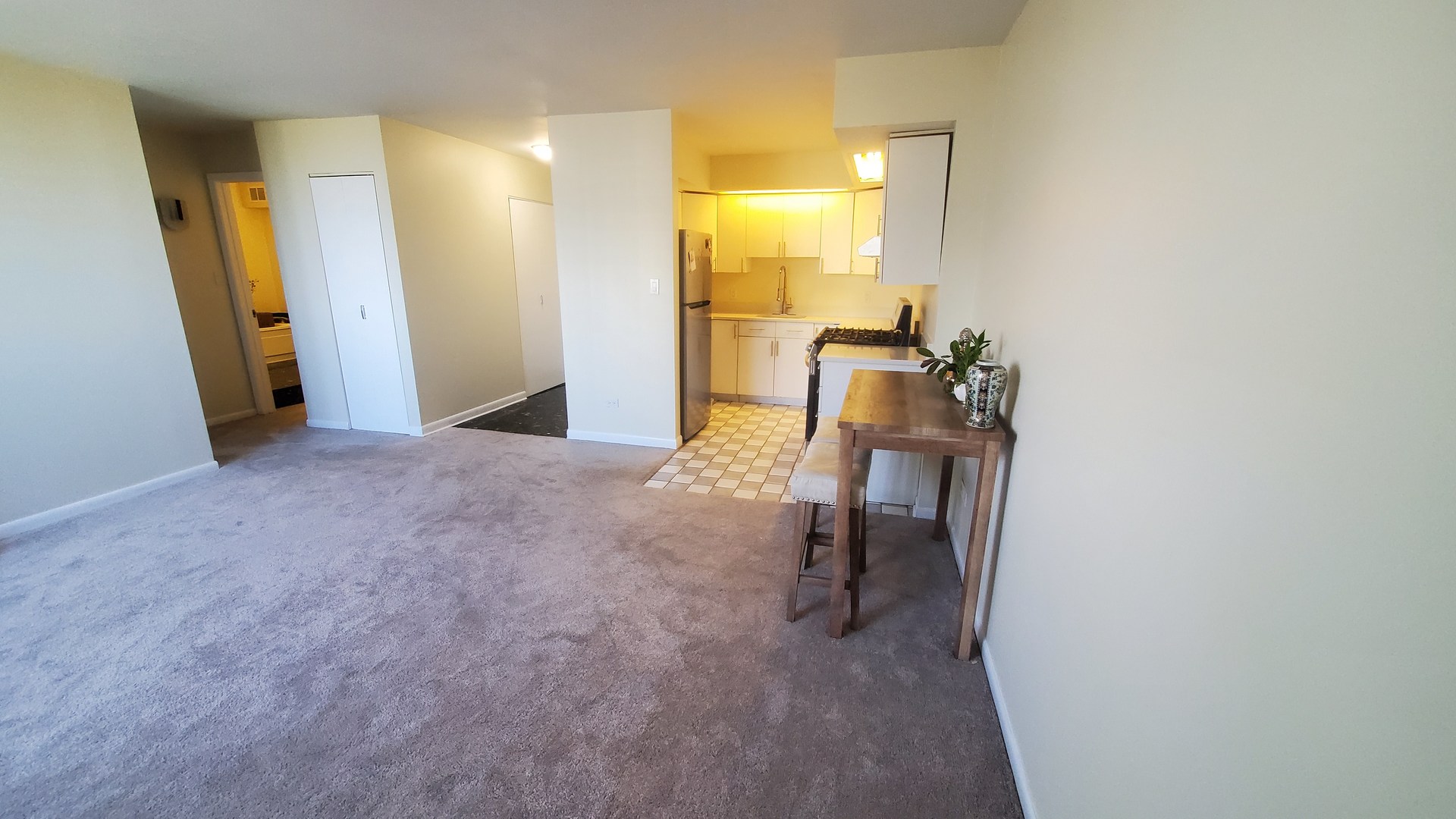 20 North Tower Road, Unit 6J Oak Brook, IL 60523 - Photo 8 of 23 a view of a hallway with a yellow slide