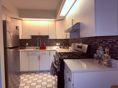 20 North Tower Road, Unit 6J Oak Brook, IL 60523 - Photo 9 of 23 a kitchen with a sink a stove and refrigerator