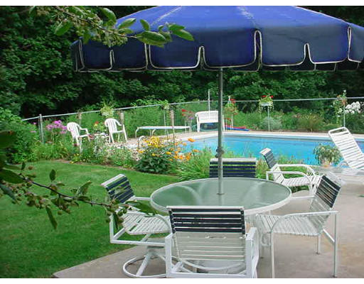 185 Viscount Road Longmeadow, MA 01106 - Photo 8 of 8 a view of a chair and table in the garden