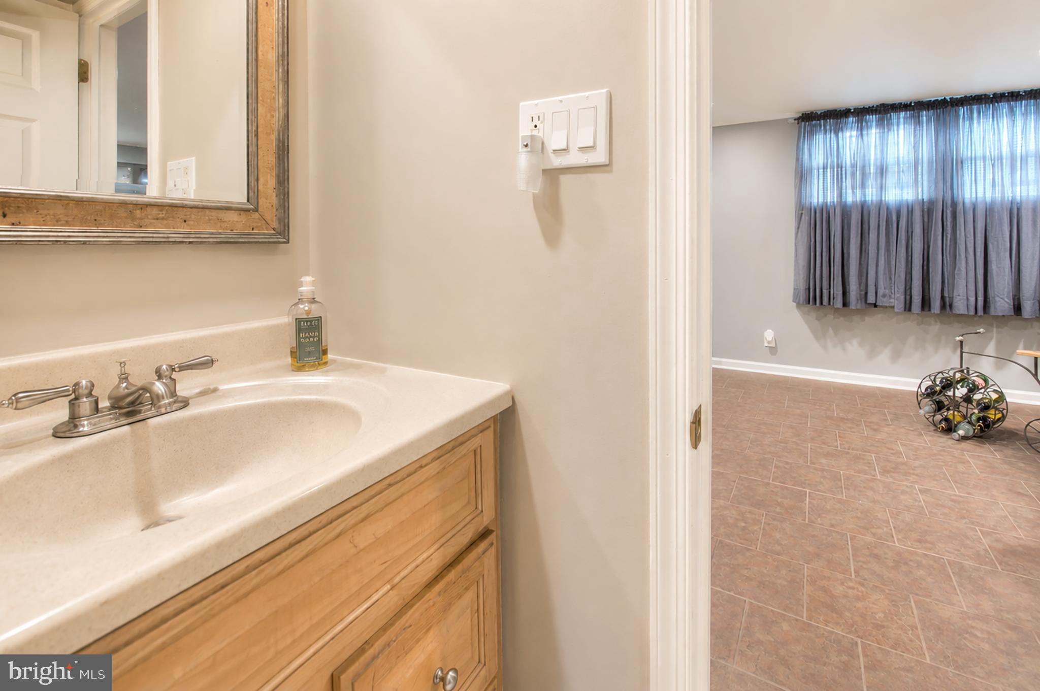 32 Bryant Road Turnersville, NJ 08012 - Photo 26 of 33 a bathroom with a sink and a mirror