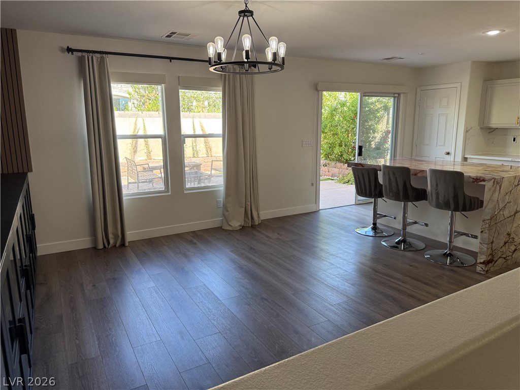 1141 Cathedral Ridge Street Henderson, NV 89052 - Photo 32 of 77 Bright open-concept living area with elegant flooring and seamless outdoor access.