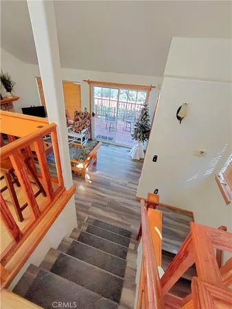 a view of an entryway with wooden floor