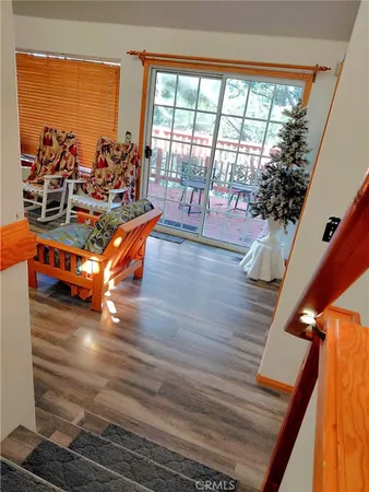 a room with wooden floor and furniture