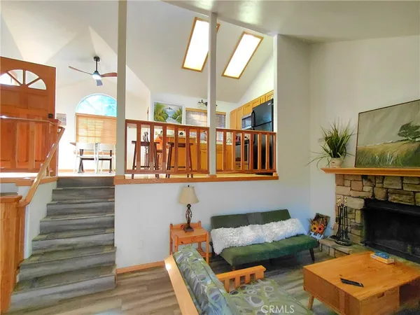 a outdoor living space with patio furniture and a fireplace