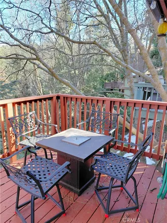a view of a chairs and table on the deck