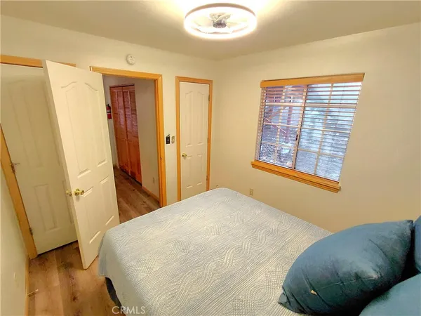 a view of staircase with white walls and railing