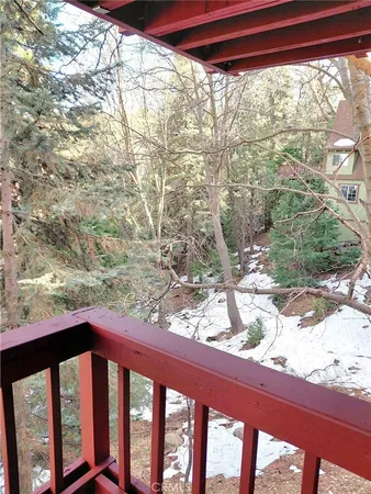 a balcony with wooden floor