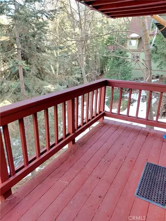 a view of balcony with wooden floor and city view