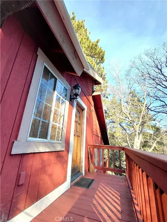 a balcony view with wooden floor and fence