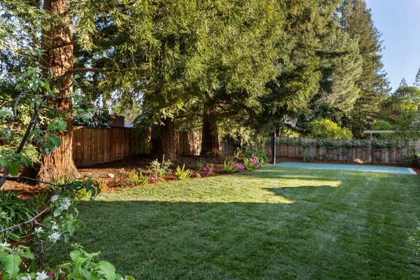 a table and chairs with the garden view