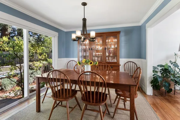a view of a dining room with furniture window and outside view