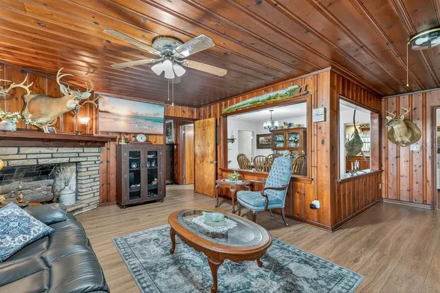 a view of a livingroom with furniture and a fireplace