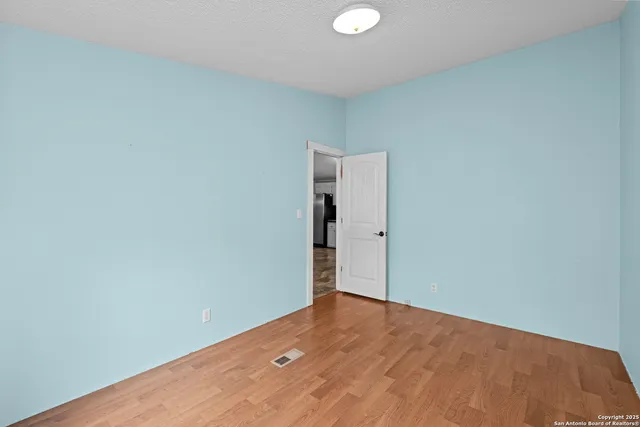 a view of a wooden door of the house