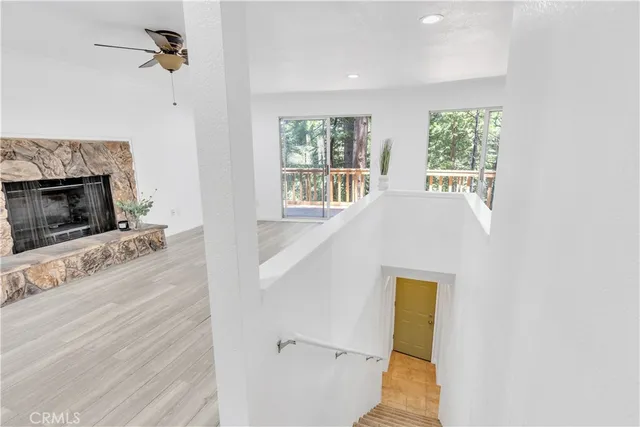 a view of a livingroom with furniture and a fireplace