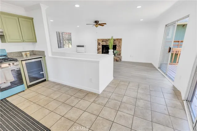 a kitchen with stainless steel appliances a stove a sink and a refrigerator