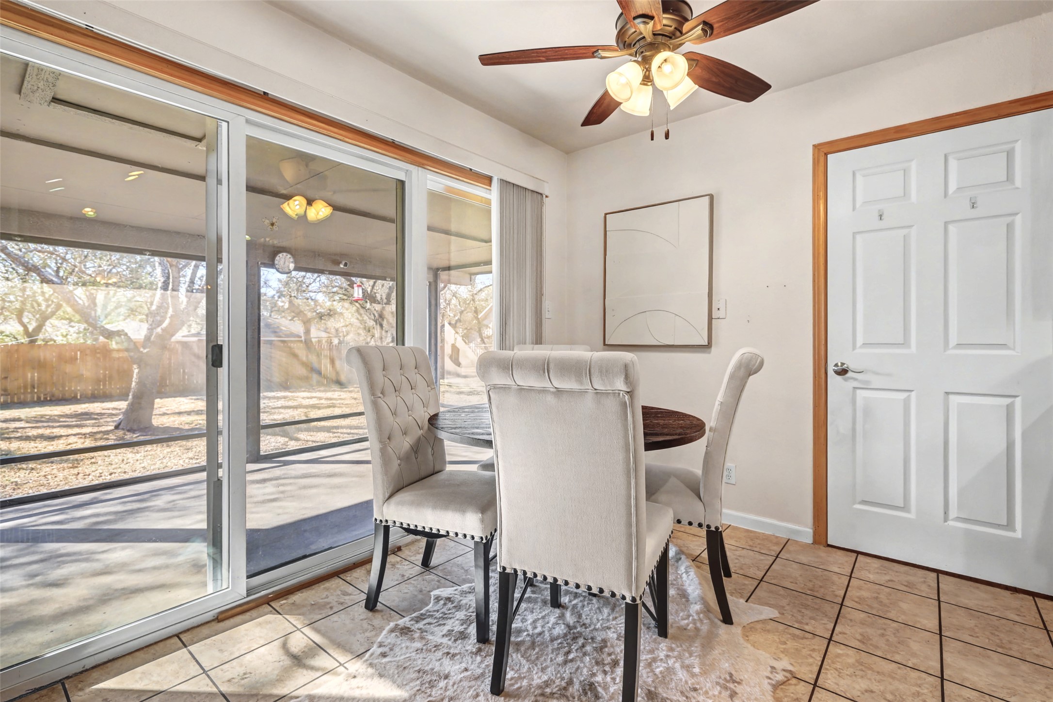238 Mesa Drive Georgetown, TX 78628 - Photo 14 of 32 Kitchen nook dining with sliding glass door to screened patio