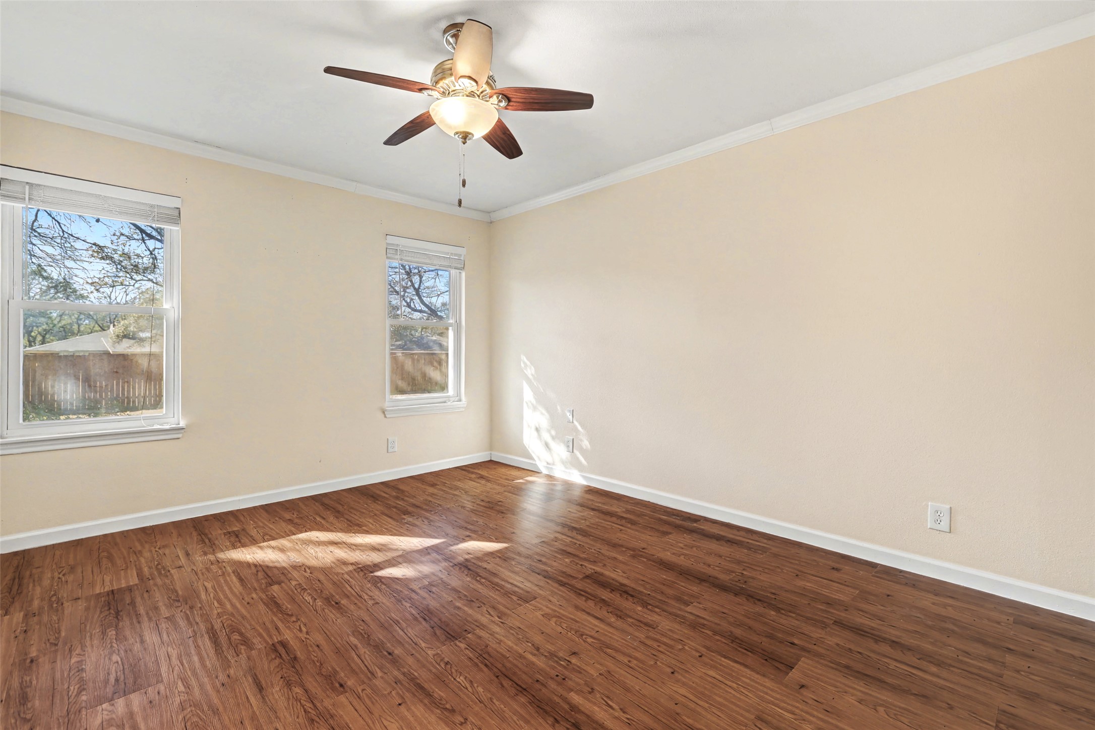 238 Mesa Drive Georgetown, TX 78628 - Photo 16 of 32 Back facing main bedroom with wood tone vinyl plank floors, and ceiling fan