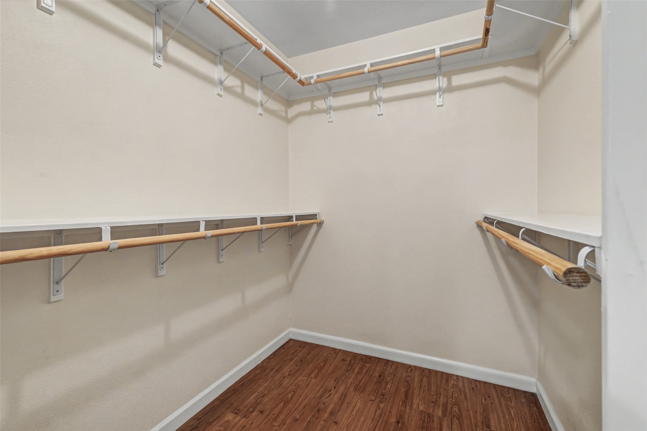 238 Mesa Drive Georgetown, TX 78628 - Photo 18 of 32 Walk in closet featuring dark wood-style flooring