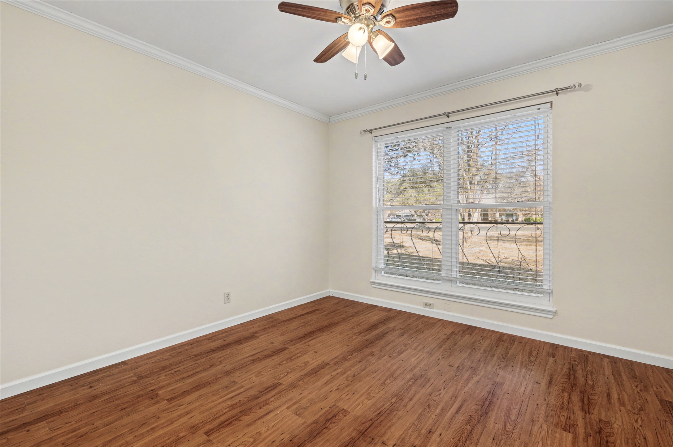 238 Mesa Drive Georgetown, TX 78628 - Photo 19 of 32 Front facing left bedroom, ceiling fan, and crown molding