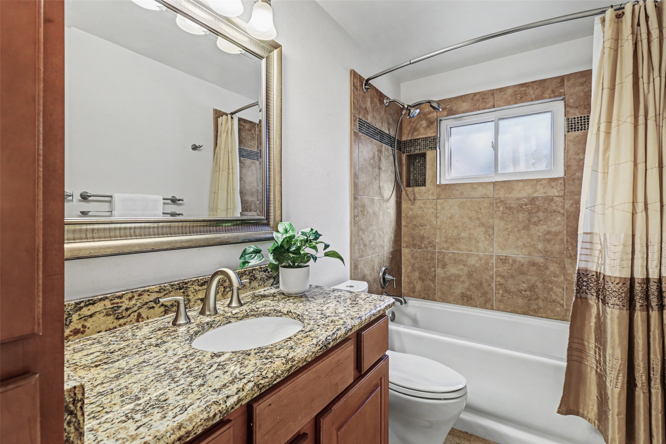 238 Mesa Drive Georgetown, TX 78628 - Photo 21 of 32 Hall bathroom featuring vanity, tub-shower bath combo