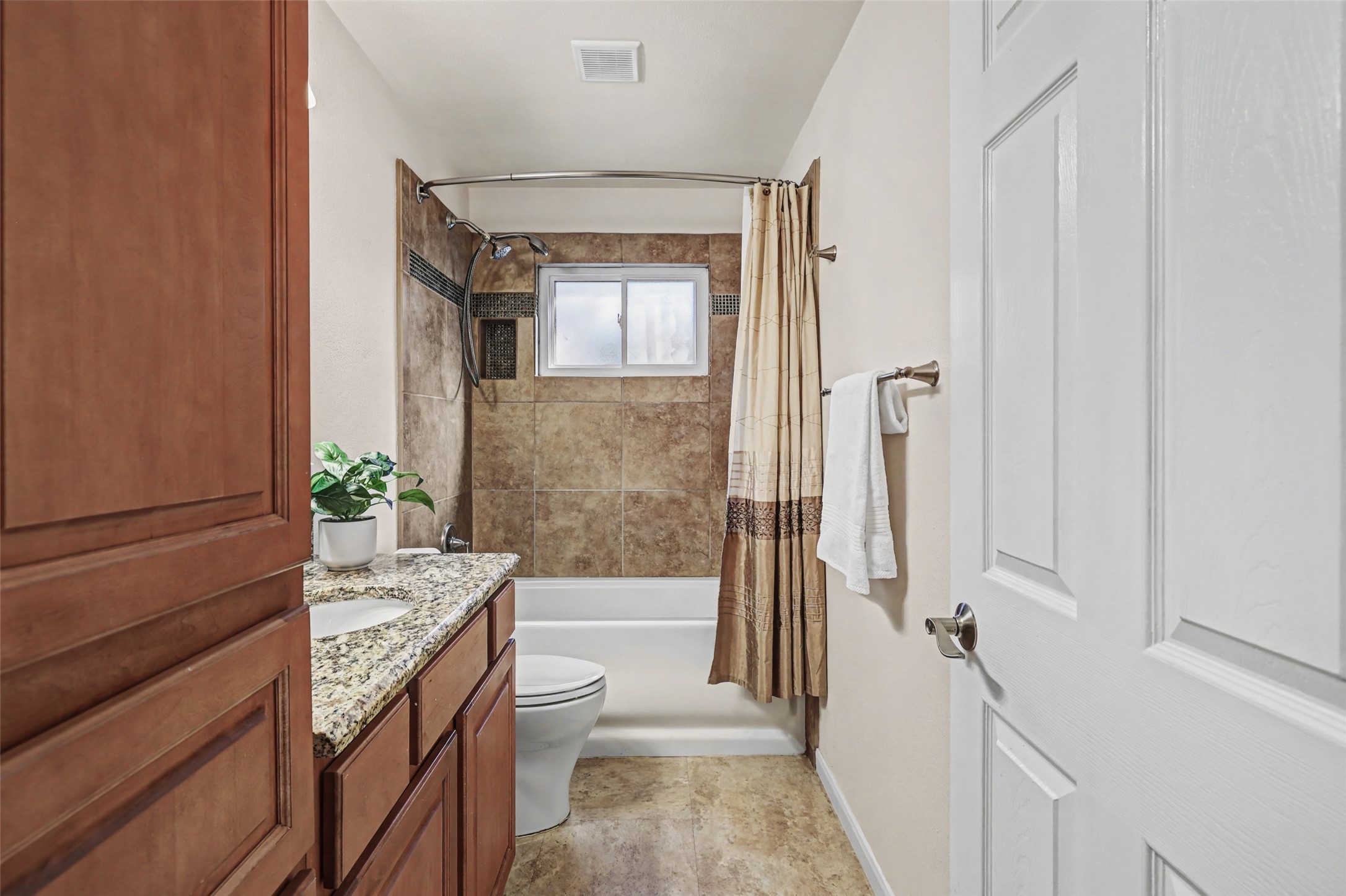 238 Mesa Drive Georgetown, TX 78628 - Photo 22 of 32 Hall bathroom with Full bath with tub-shower combo and linen storage cabinet