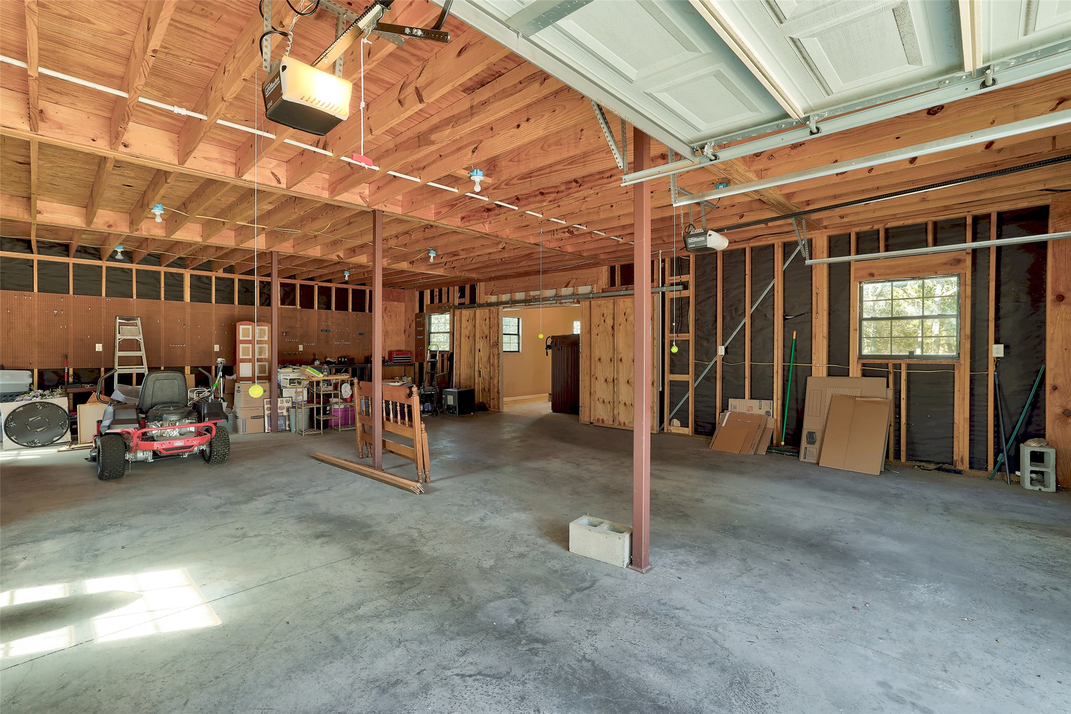 238 Mesa Drive Georgetown, TX 78628 - Photo 28 of 32 4-car tandem garage featuring a double garage doors