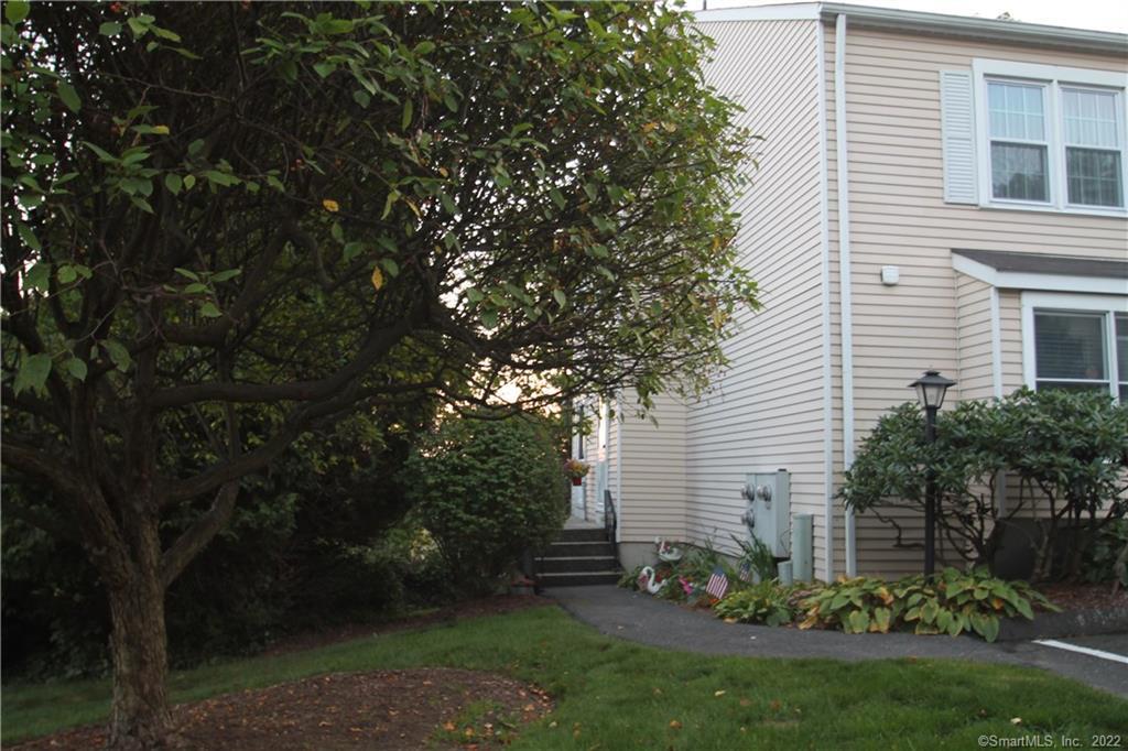 55 Mill Plain Road, Unit 271 Danbury, CT 06811 - Photo 1 of 1 a view of a house with a backyard