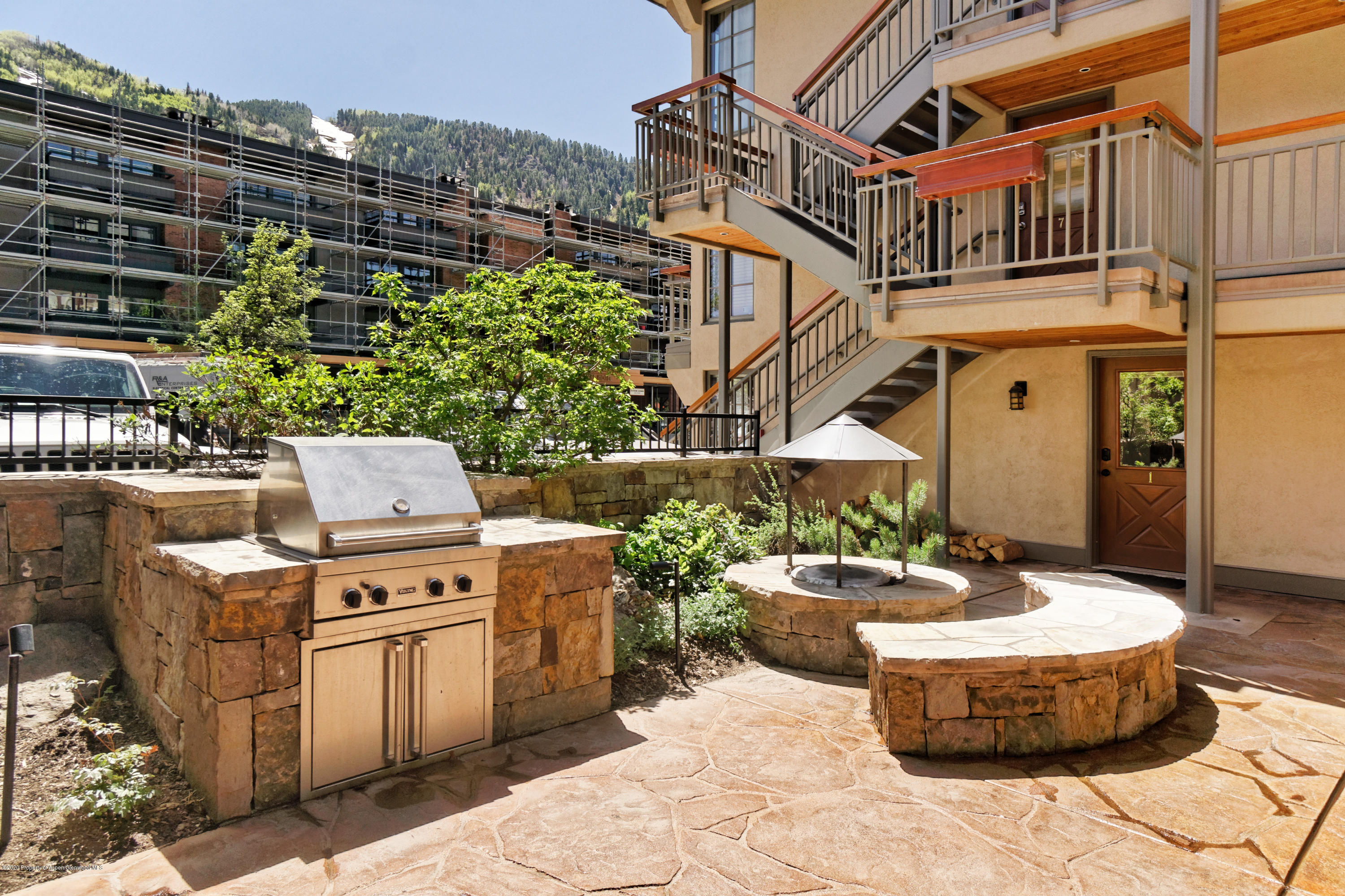 630 East Cooper Avenue, Unit 1 Aspen, CO 81611 - Photo 19 of 25 a front view of a house with a garden