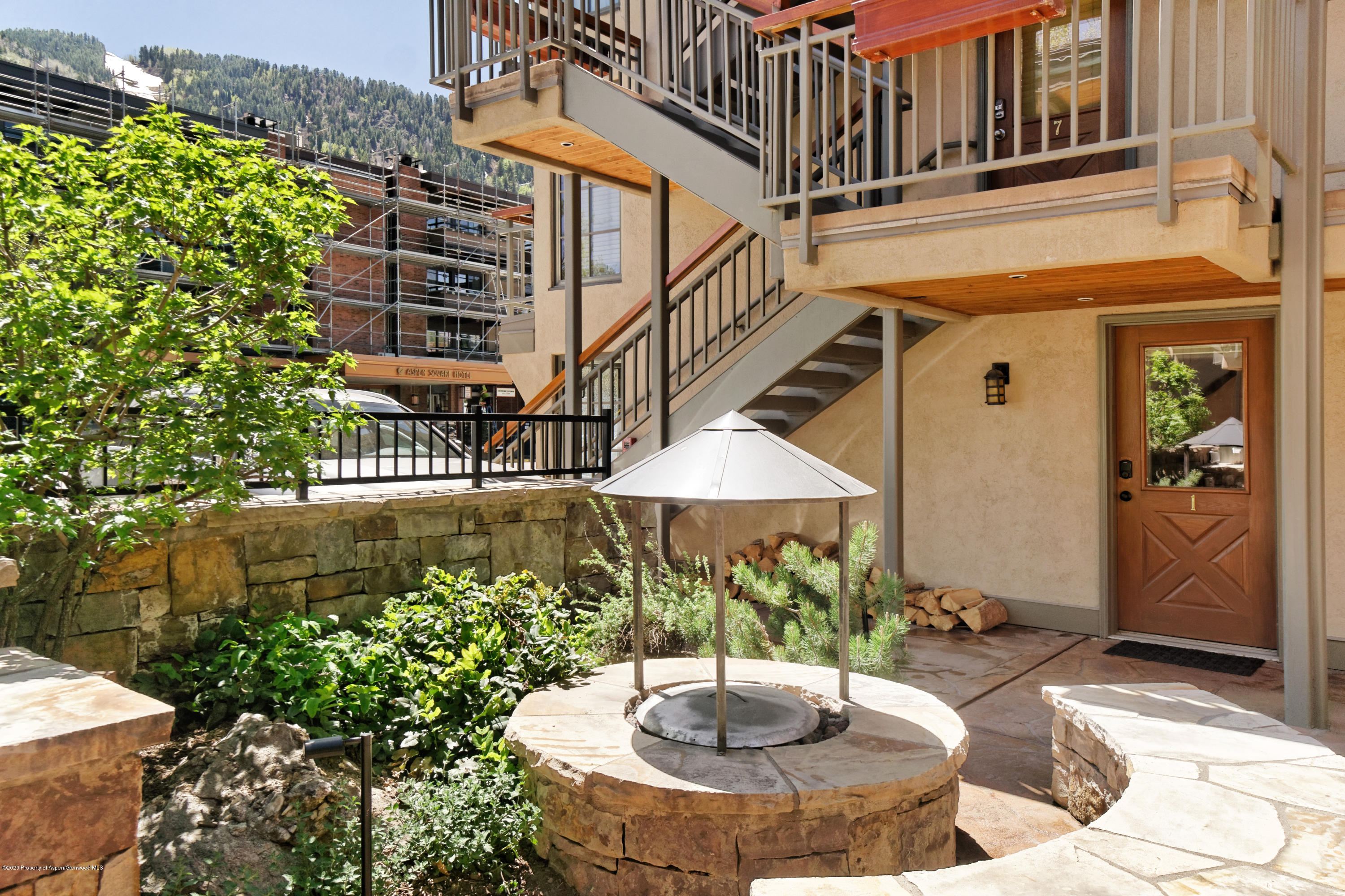 630 East Cooper Avenue, Unit 1 Aspen, CO 81611 - Photo 20 of 25 a view of a house with backyard and sitting area