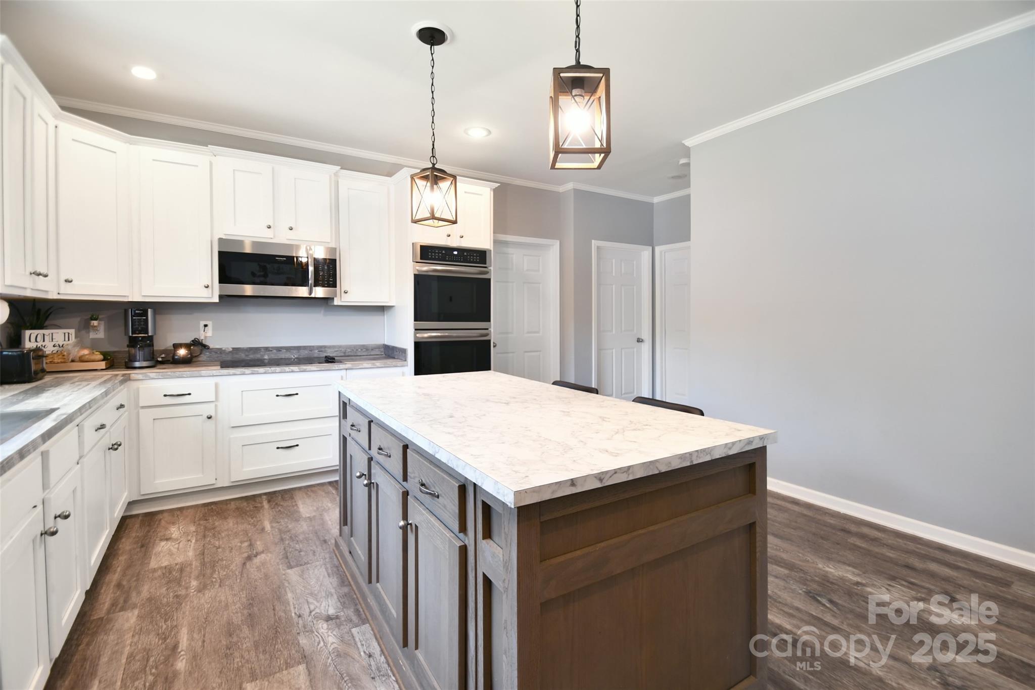 265 St Matthew Church Road Salisbury, NC 28146 - Photo 13 of 42 a kitchen with a stove a sink and a refrigerator