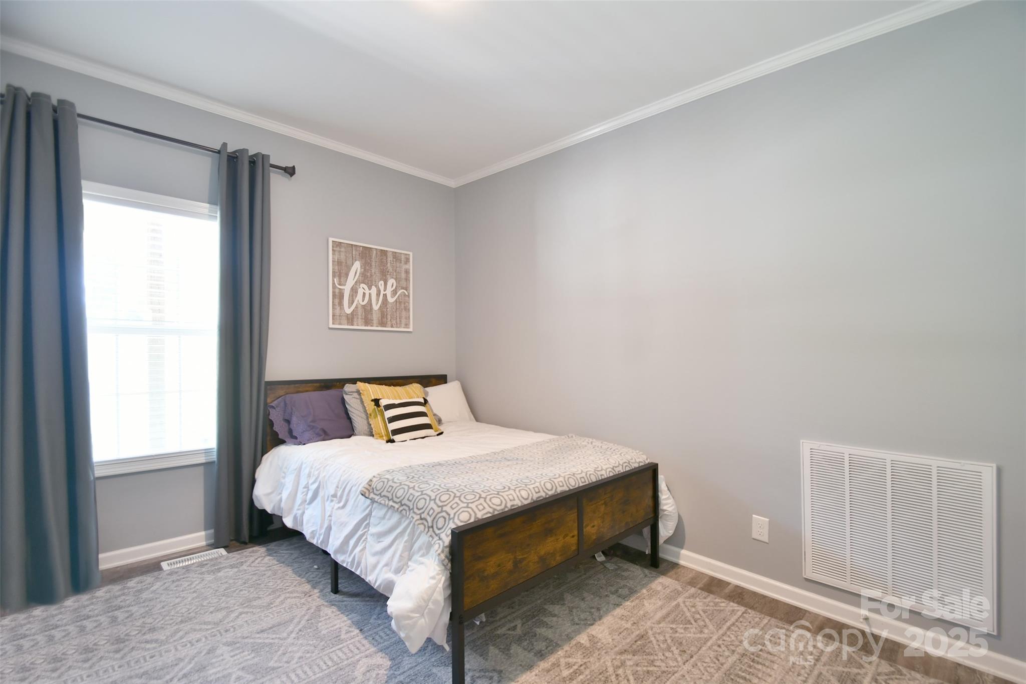 265 St Matthew Church Road Salisbury, NC 28146 - Photo 17 of 42 a bedroom with a bed and window