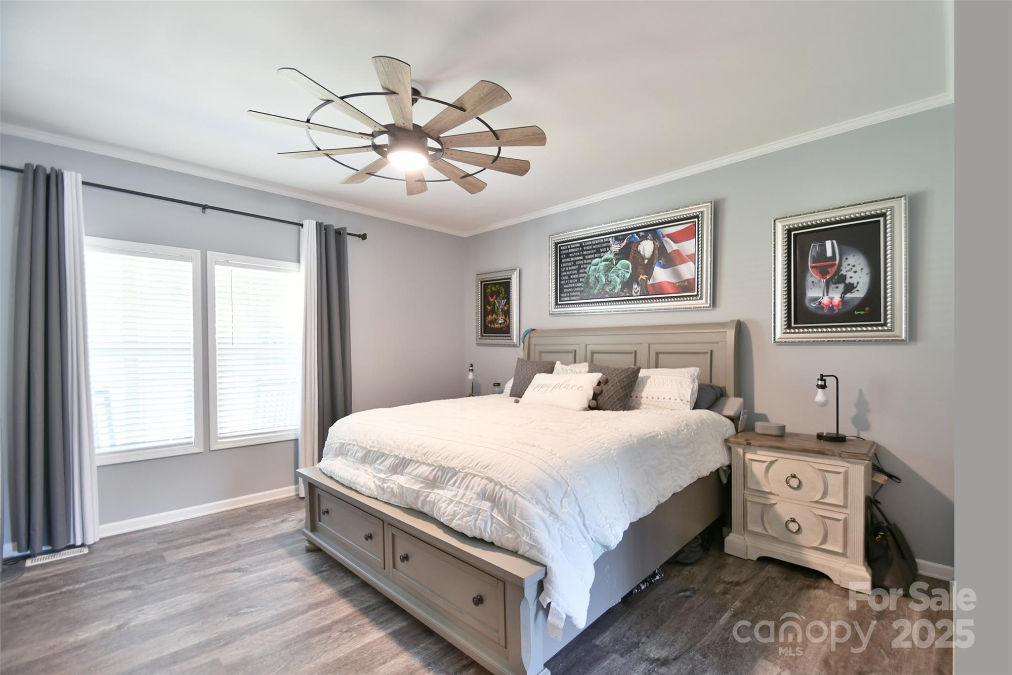 265 St Matthew Church Road Salisbury, NC 28146 - Photo 18 of 42 a bedroom with a large bed and a chandelier