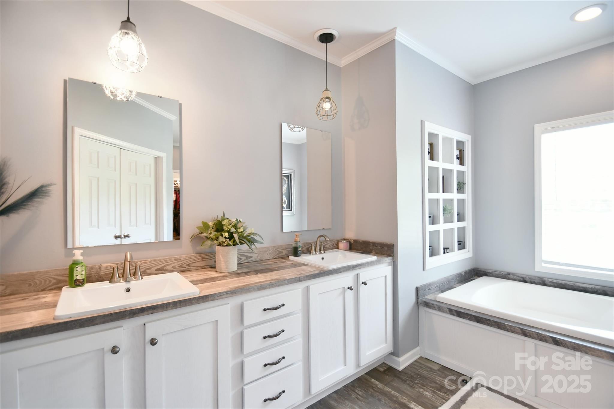 265 St Matthew Church Road Salisbury, NC 28146 - Photo 19 of 42 a bathroom with a granite countertop sink mirror and a bathtub