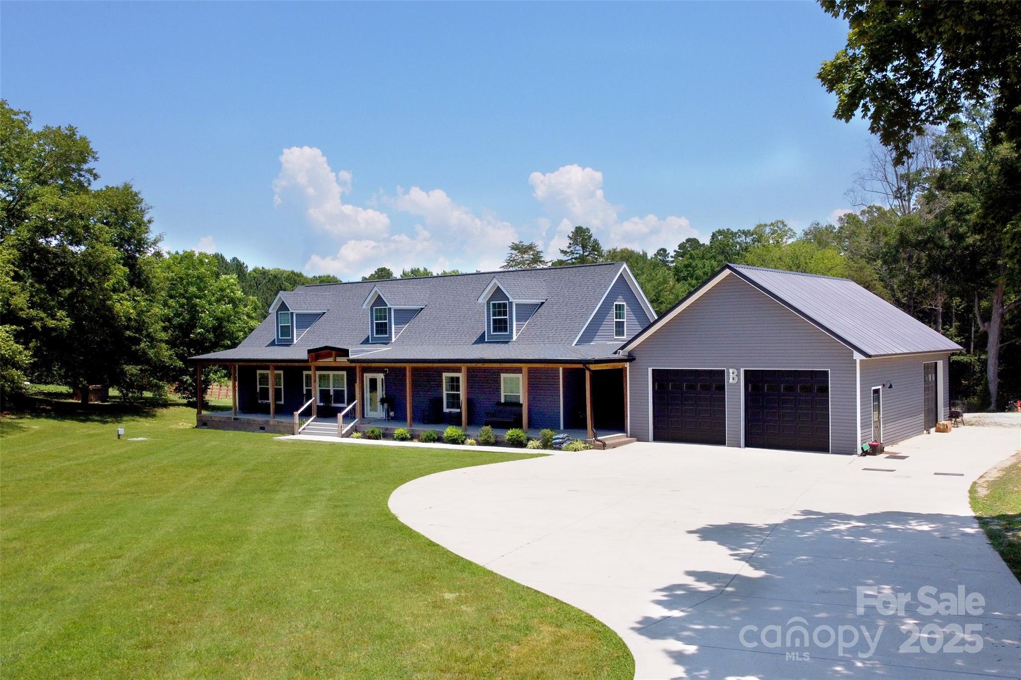 265 St Matthew Church Road Salisbury, NC 28146 - Photo 2 of 42 a view of a house with a big yard and large trees