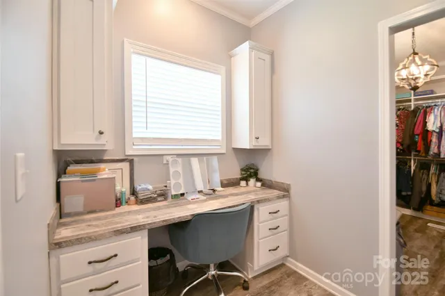 a kitchen with a sink cabinets and window