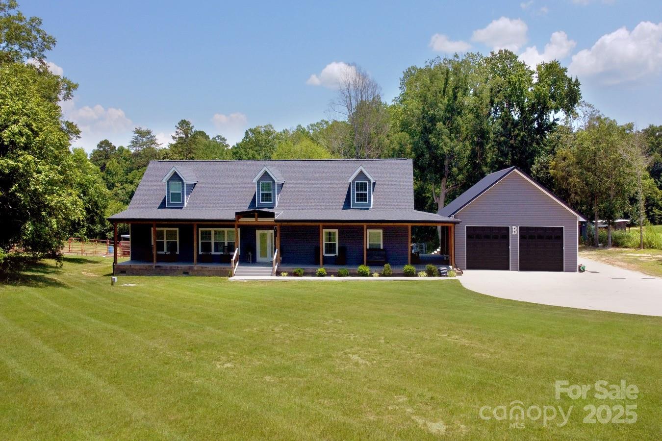 265 St Matthew Church Road Salisbury, NC 28146 - Photo 3 of 42 a front view of a house with a garden and trees