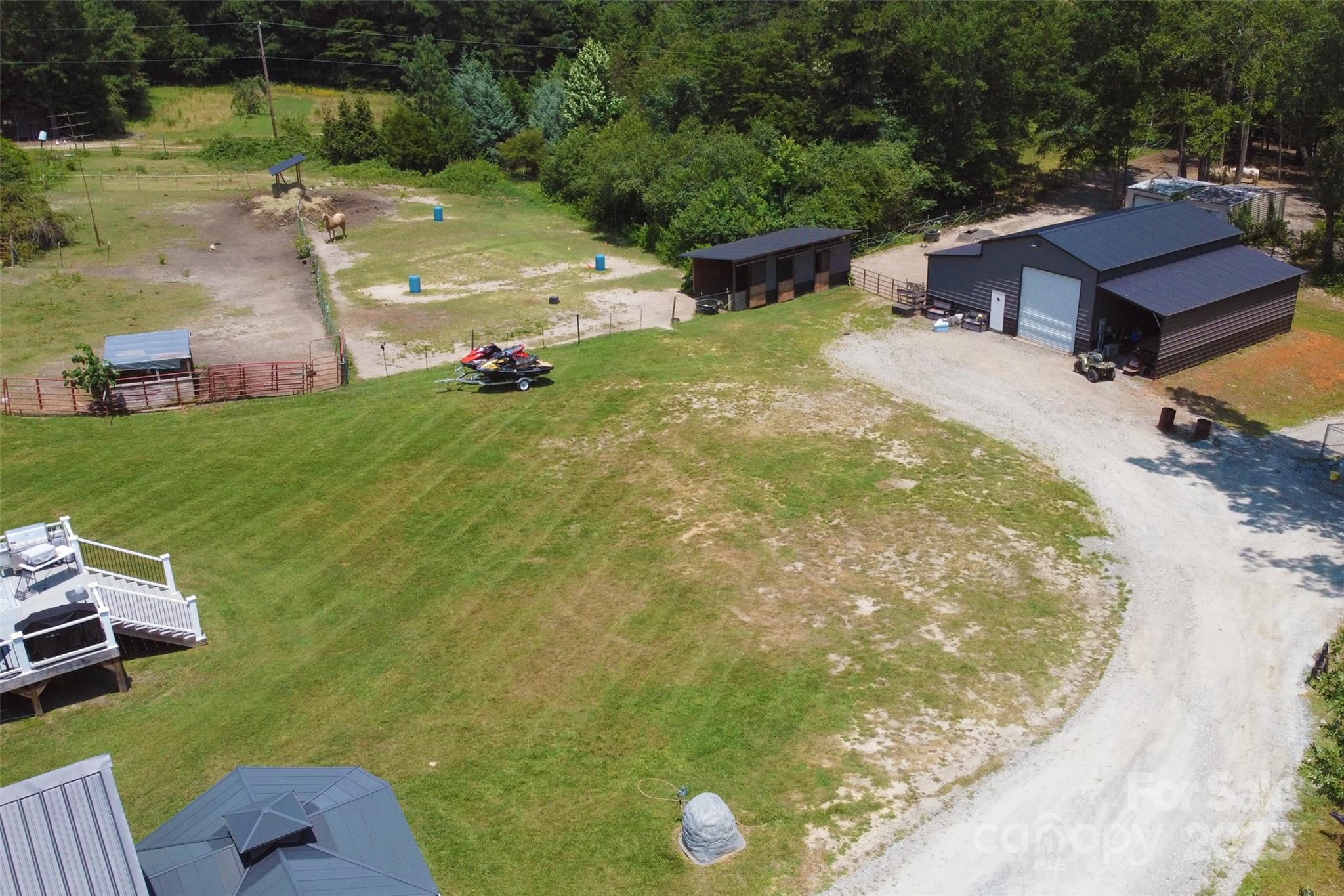 265 St Matthew Church Road Salisbury, NC 28146 - Photo 38 of 42 an aerial view of a house with garden space and a car parked