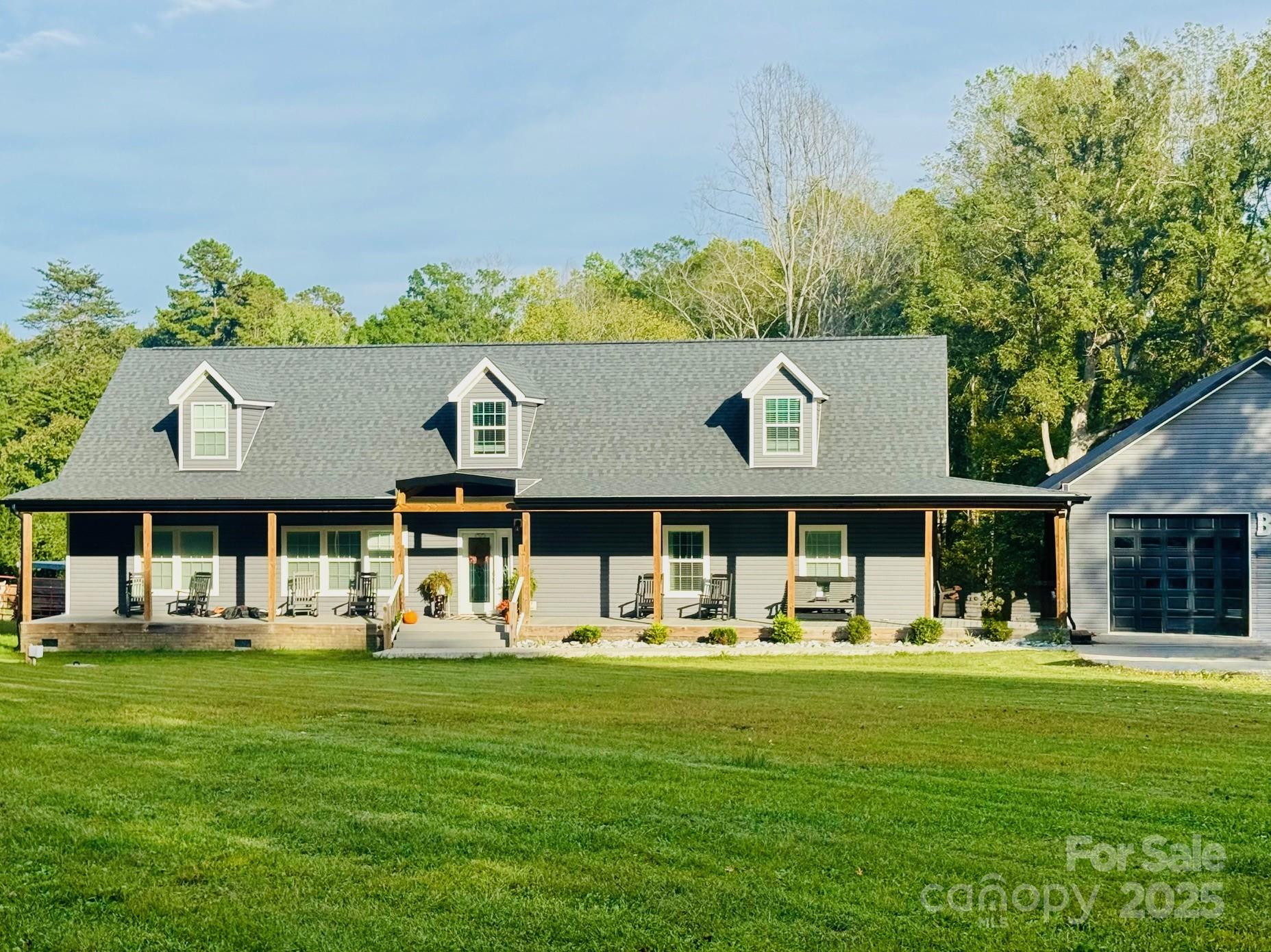 265 St Matthew Church Road Salisbury, NC 28146 - Photo 5 of 42 a front view of a house with garden and trees