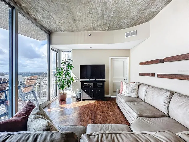 a bathroom with a granite countertop toilet and a shower