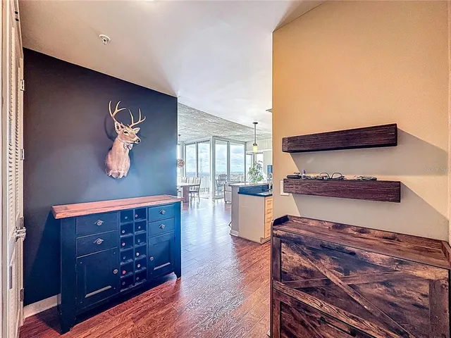 a spacious bathroom with a toilet a sink and a large mirror