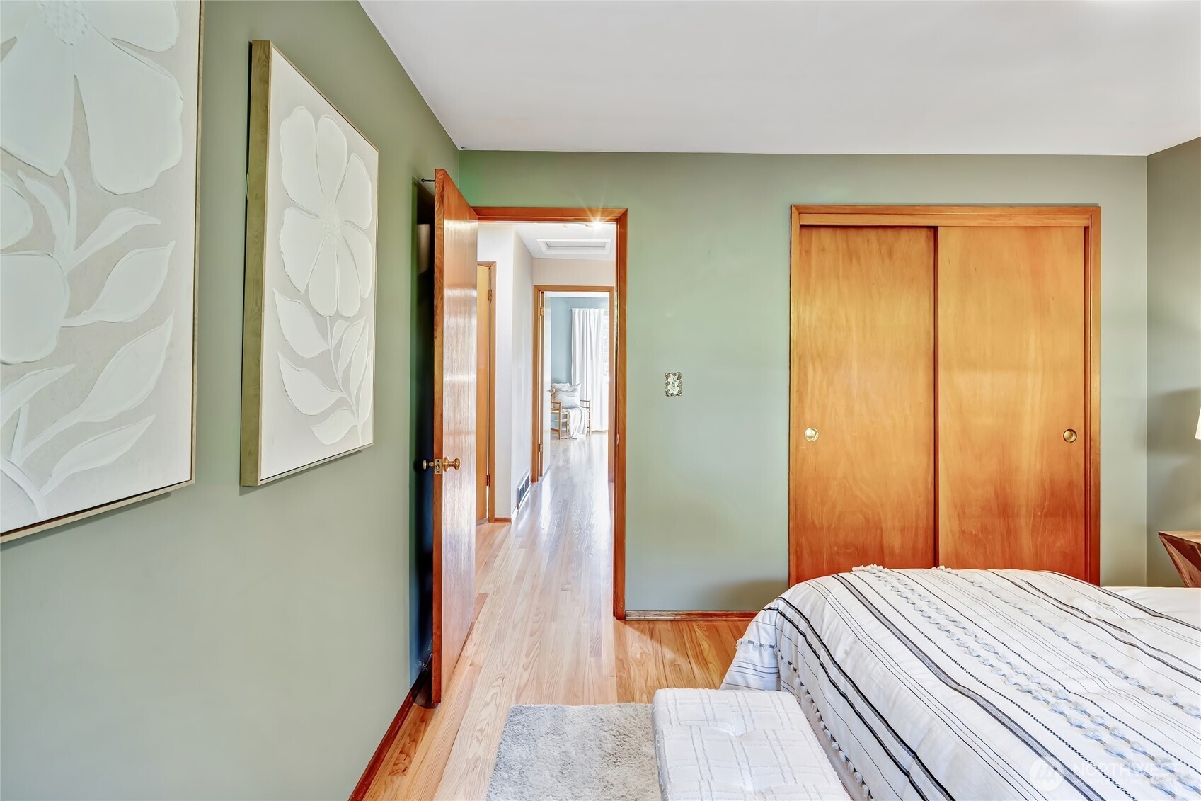 7571 45th Avenue Southwest Seattle, WA 98136 - Photo 20 of 40 a bedroom with a bed and wooden floor