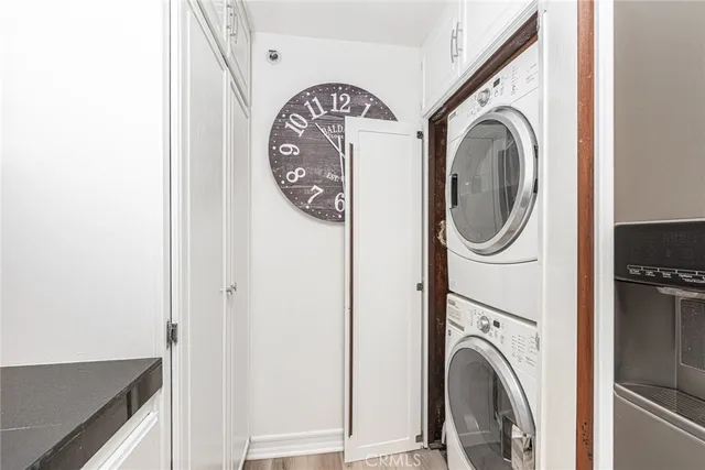 a view of a hallway with washer and dryer