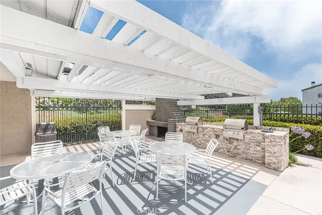 a view of a dining hall with furniture wooden floor and garden view