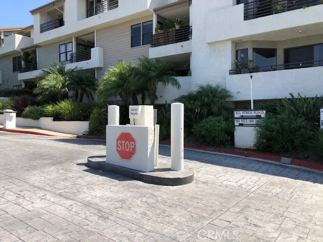 a wooden bench sitting in front of a building